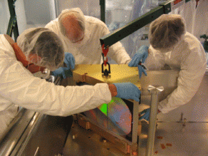 The APOGEE mosaic Volume Phase Holographic (VPH) grating is installed during instrument assembly at the University of Virginia.