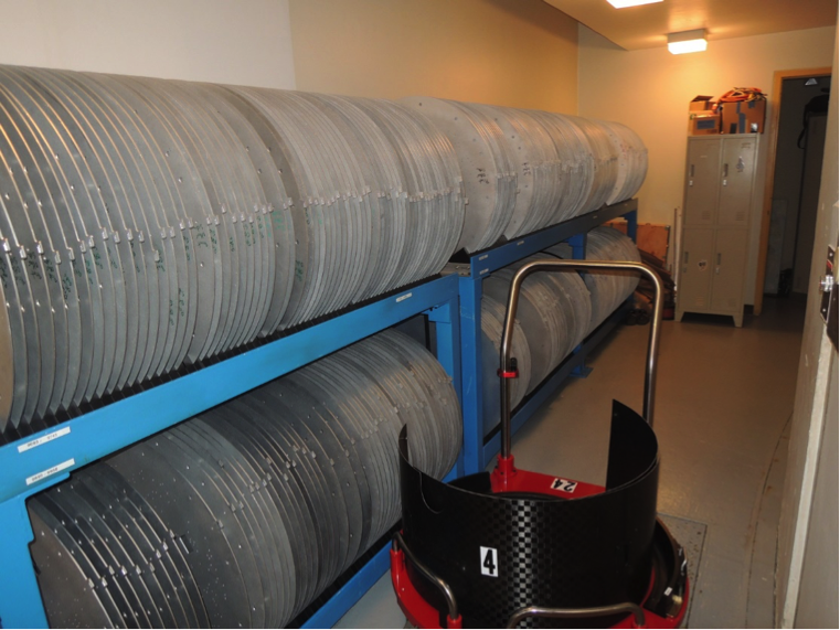  Plate storage racks at the du Pont Telescope. To the right of the racks is an empty cart. <em>Photo courtesy of J. Wilson.</em> 